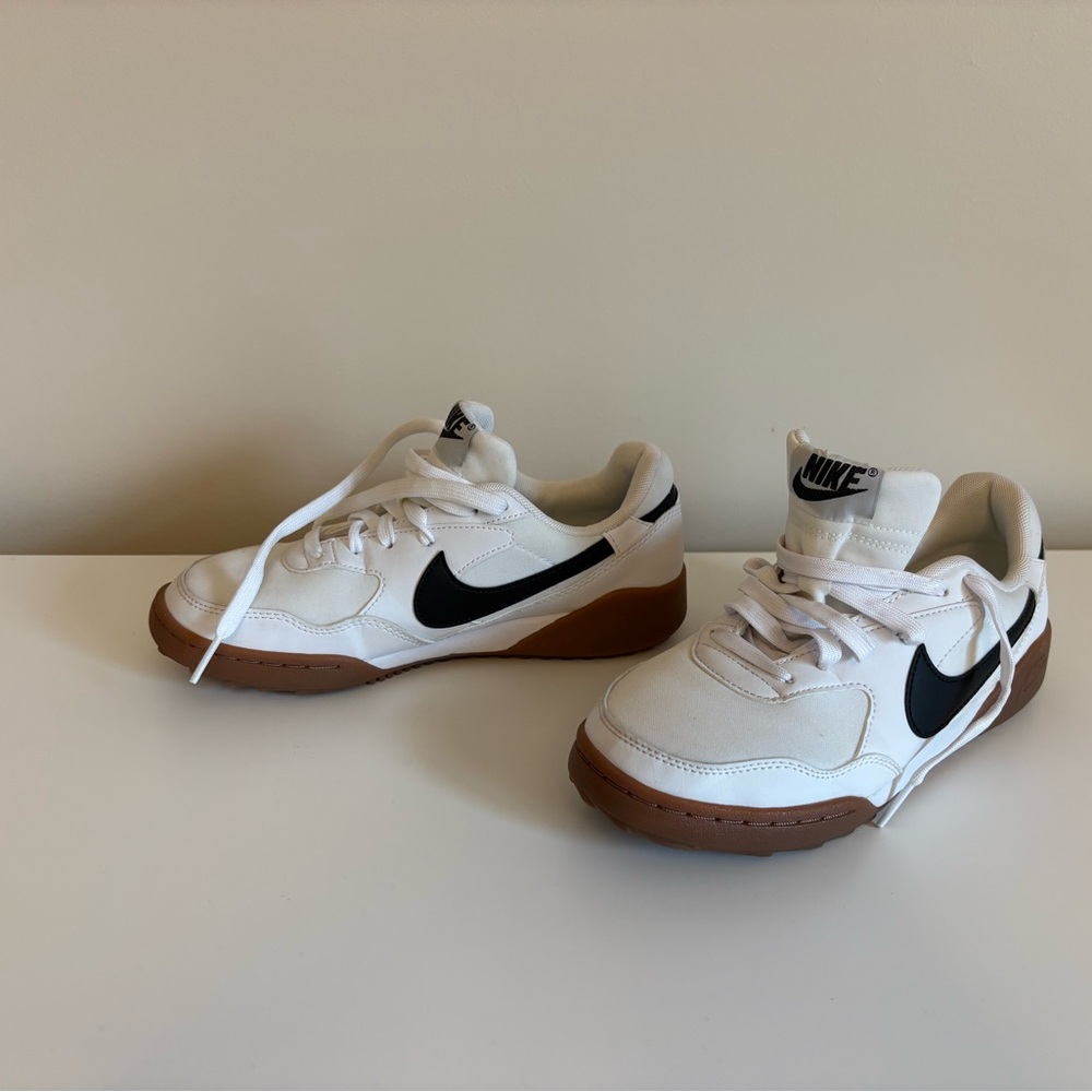 Nike Kids White Sneakers with Black Swoosh and Gum Sole